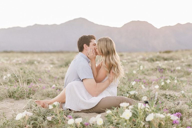 Couple sitting in the wildflowers in Anza Borrego State Park for elopement photos
