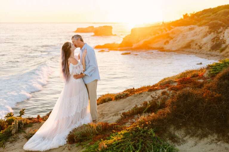 Elopement couple kissing at sunset in Laguna Beach, CA